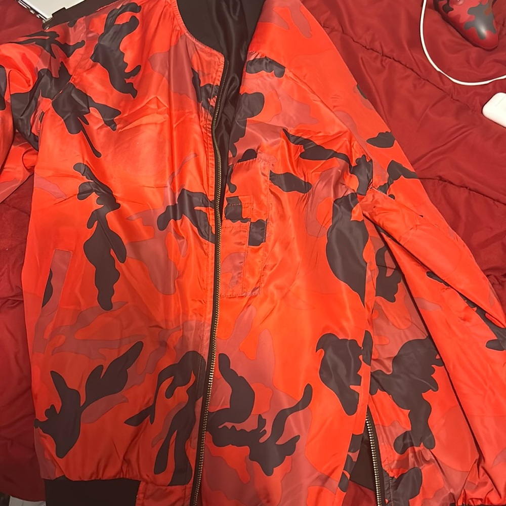 I am selling a red and black bomber jacket, It is a size medium.